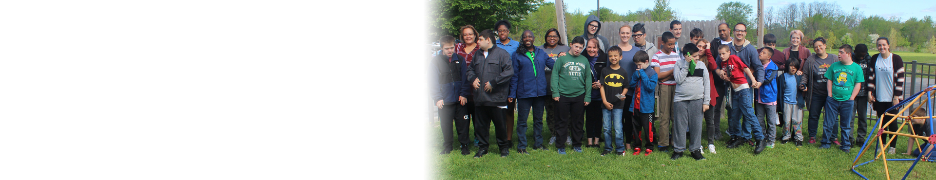 Trinity School Page Banner - image of school staff and students posing for photo